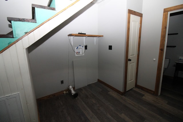 laundry area featuring dark wood-type flooring