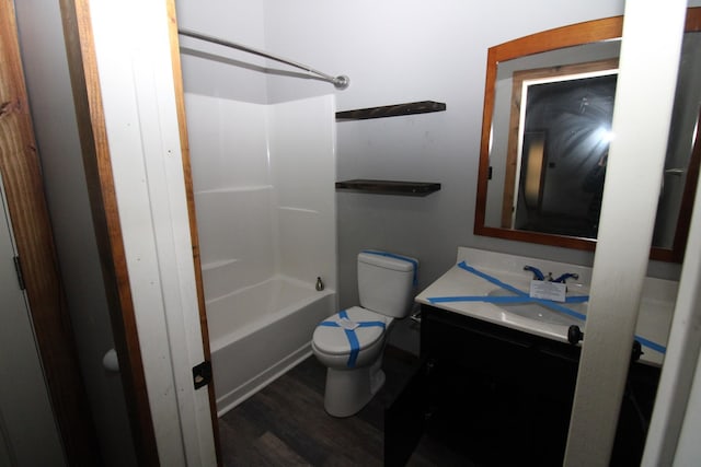 full bathroom featuring shower / tub combination, wood-type flooring, vanity, and toilet