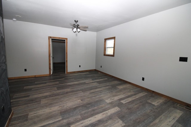 spare room featuring ceiling fan and dark hardwood / wood-style flooring