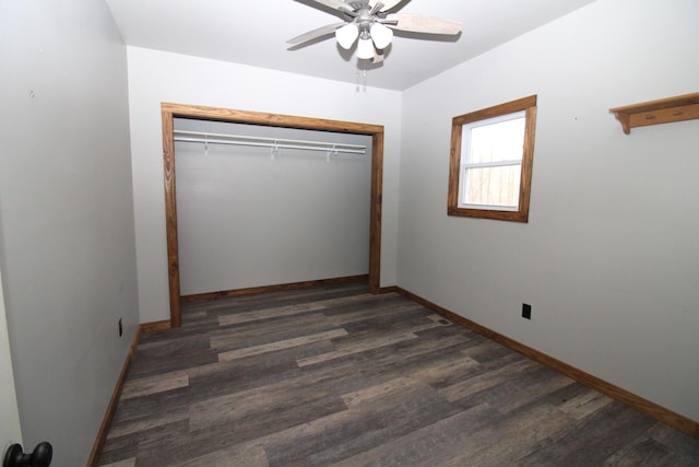 unfurnished bedroom featuring dark hardwood / wood-style flooring, a closet, and ceiling fan