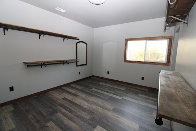 unfurnished bedroom featuring dark hardwood / wood-style floors