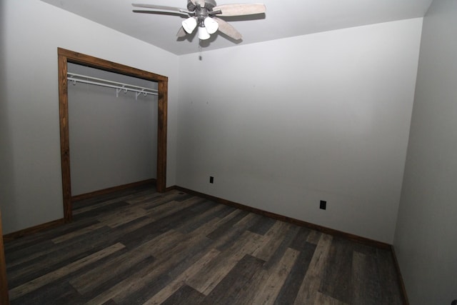 unfurnished bedroom featuring dark wood-type flooring, a closet, and ceiling fan