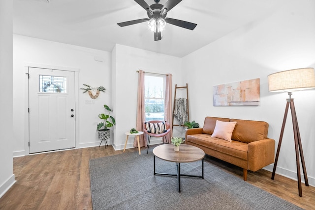 living room featuring wood-type flooring, a wealth of natural light, and ceiling fan