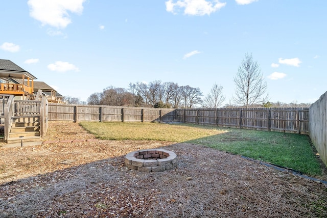 view of yard featuring a fire pit