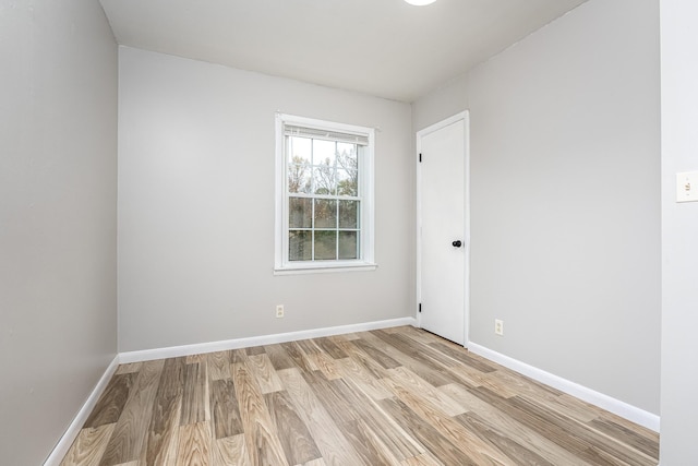 unfurnished room featuring light hardwood / wood-style floors