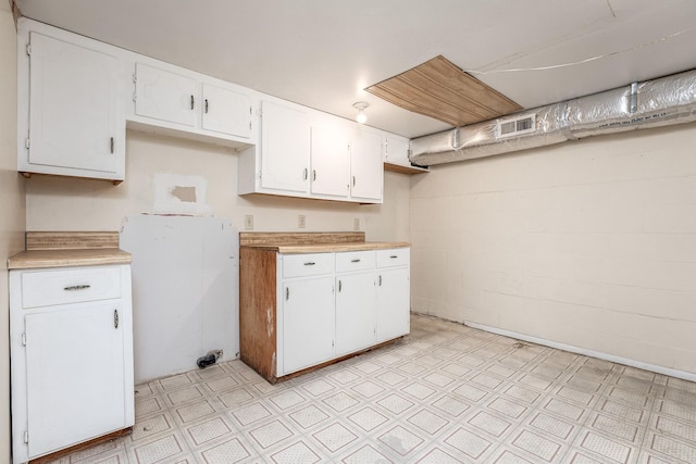 kitchen featuring white cabinets