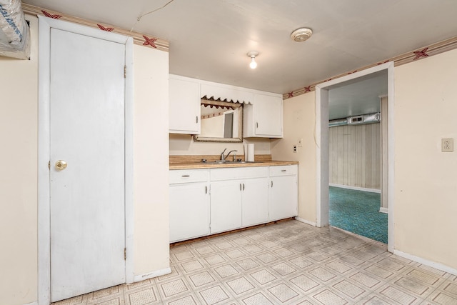 kitchen with sink and white cabinets