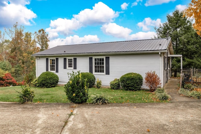 view of side of home featuring a yard