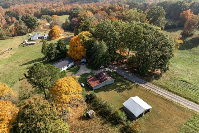 birds eye view of property with a rural view