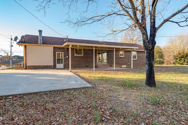 rear view of house featuring a patio