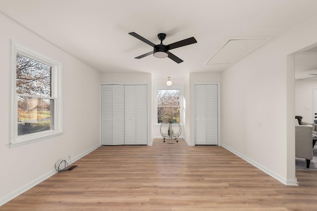 unfurnished bedroom with ceiling fan and light hardwood / wood-style flooring