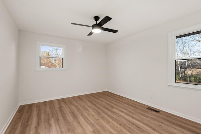 unfurnished room featuring ceiling fan and light hardwood / wood-style floors