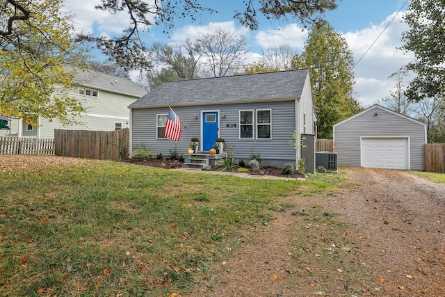 bungalow-style home with a front lawn, a garage, an outdoor structure, and central AC