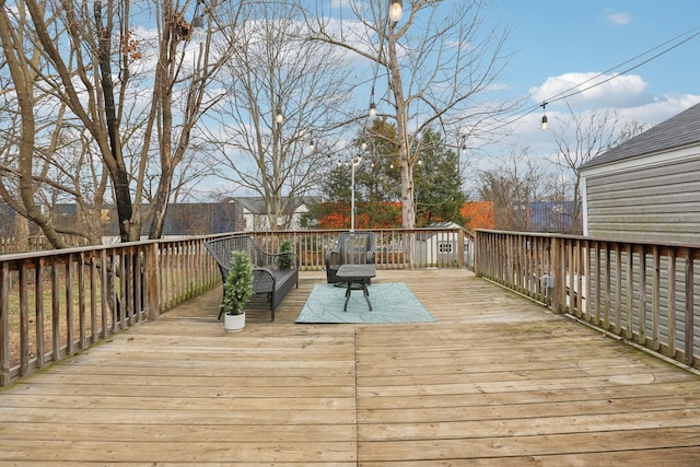 wooden terrace featuring an outdoor hangout area