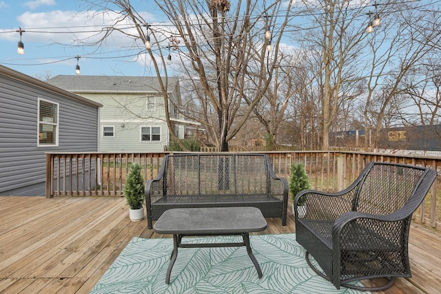 wooden terrace featuring outdoor lounge area