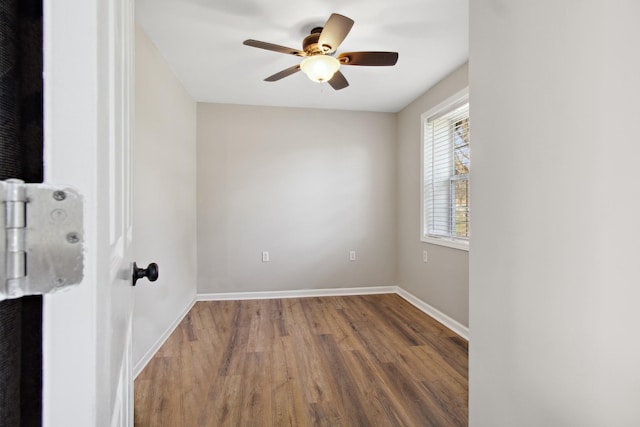 spare room featuring hardwood / wood-style flooring and ceiling fan