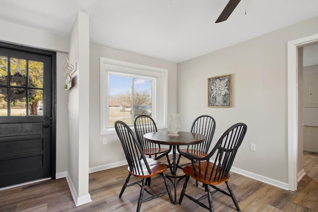 dining area featuring ceiling fan and dark hardwood / wood-style flooring