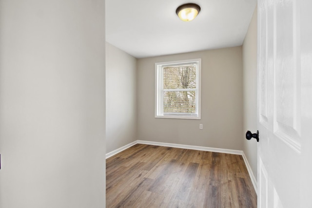 empty room with light hardwood / wood-style flooring