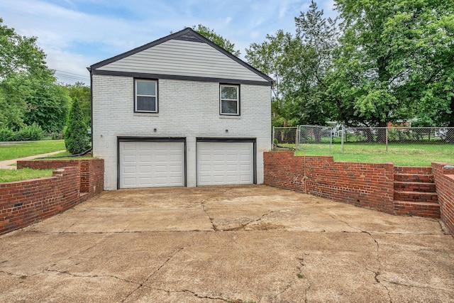 view of side of home featuring a garage