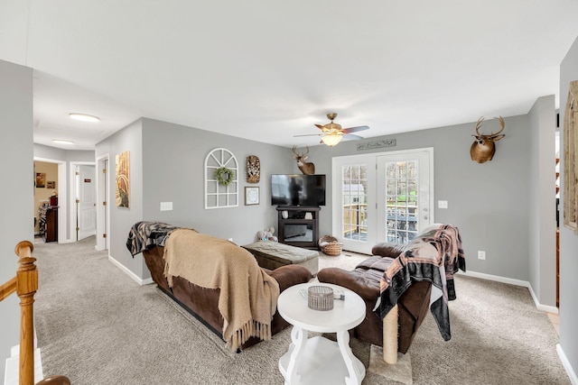 living room featuring light colored carpet and ceiling fan