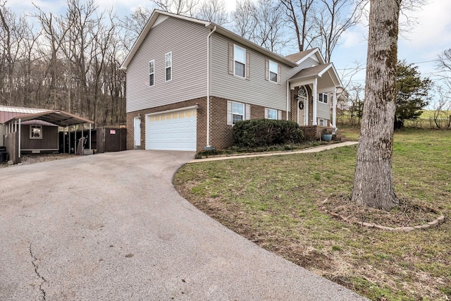 view of front of home with a front lawn, a carport, and a garage