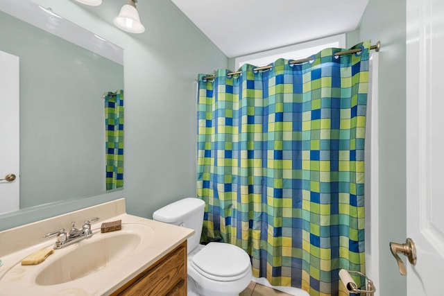 bathroom with toilet, a shower with shower curtain, and vanity