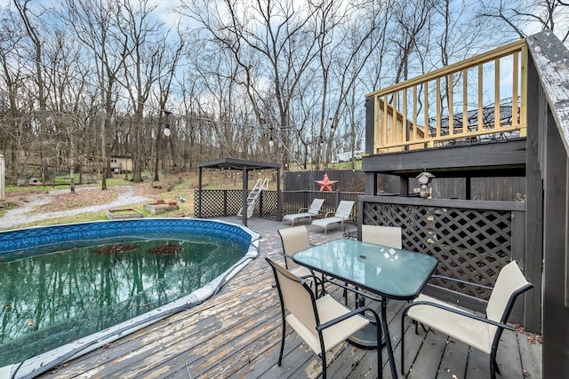 wooden terrace featuring a gazebo