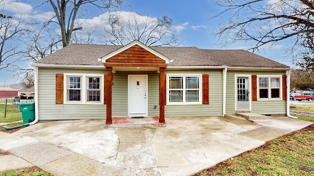 bungalow-style house with a patio