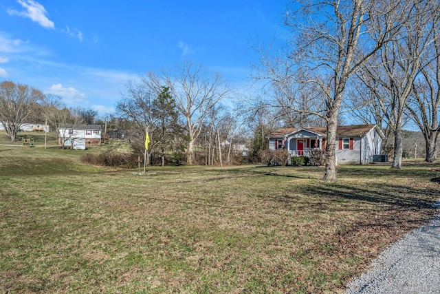 view of yard featuring covered porch