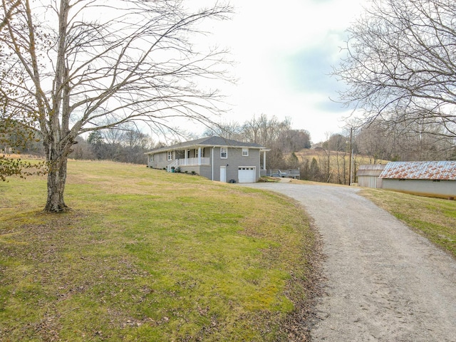 view of front of house with a garage and a front lawn