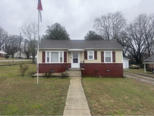 view of front facade featuring a garage and a front lawn