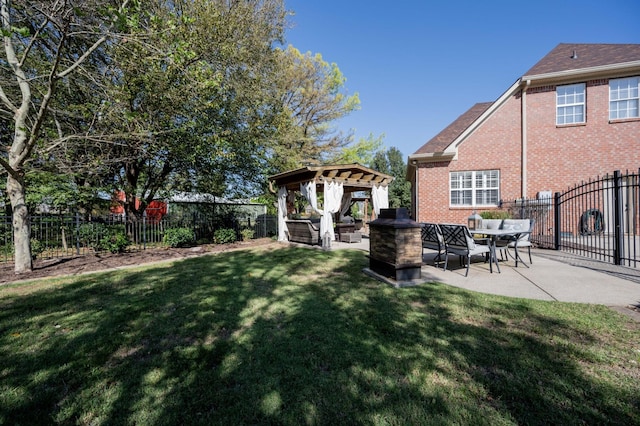 view of yard with a gazebo, a patio area, and an outdoor living space with a fire pit