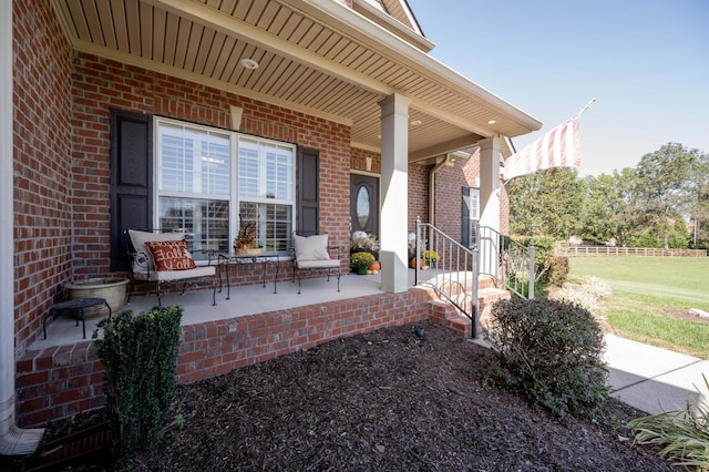 property entrance featuring a porch