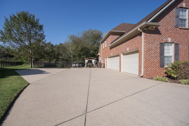 view of side of property with a garage