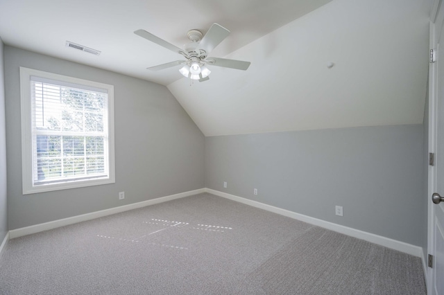 bonus room featuring ceiling fan, vaulted ceiling, and carpet