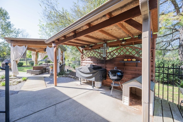 view of patio featuring a grill and an outdoor living space with a fireplace