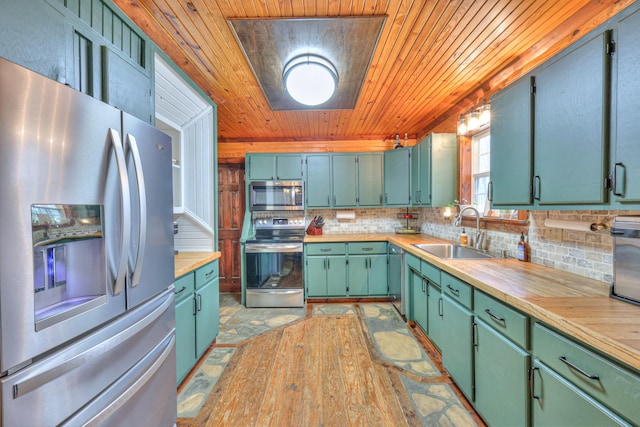 kitchen with tasteful backsplash, sink, stainless steel appliances, wooden ceiling, and light wood-type flooring