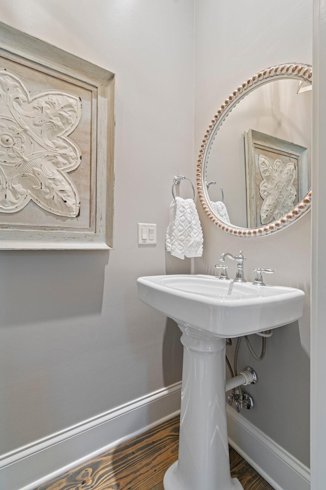 bathroom with hardwood / wood-style flooring