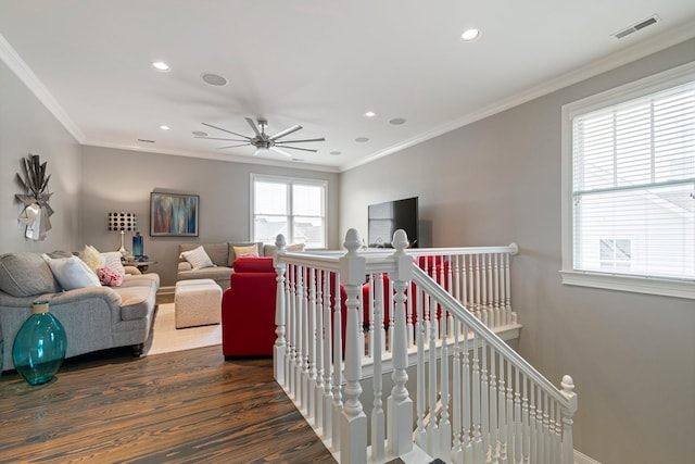 living room with crown molding and dark hardwood / wood-style flooring