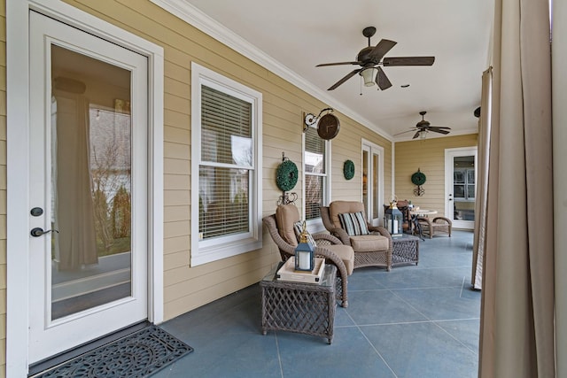 view of patio featuring ceiling fan and a porch