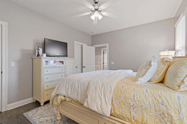 bedroom with ceiling fan and dark hardwood / wood-style flooring