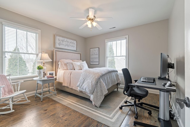 bedroom with hardwood / wood-style flooring and ceiling fan