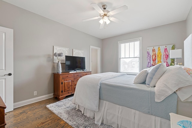 bedroom with dark wood-type flooring and ceiling fan