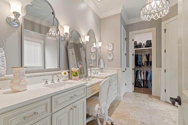 bathroom featuring ornamental molding, vanity, tile patterned floors, and a notable chandelier