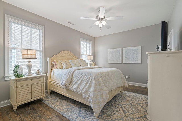 bedroom featuring ceiling fan and dark hardwood / wood-style flooring