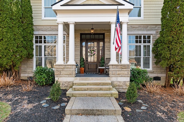 property entrance featuring covered porch