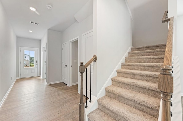 stairway with wood-type flooring