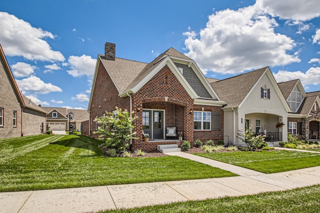 view of front facade with a garage and a front lawn