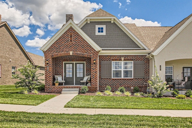 view of front of property featuring a front lawn and covered porch