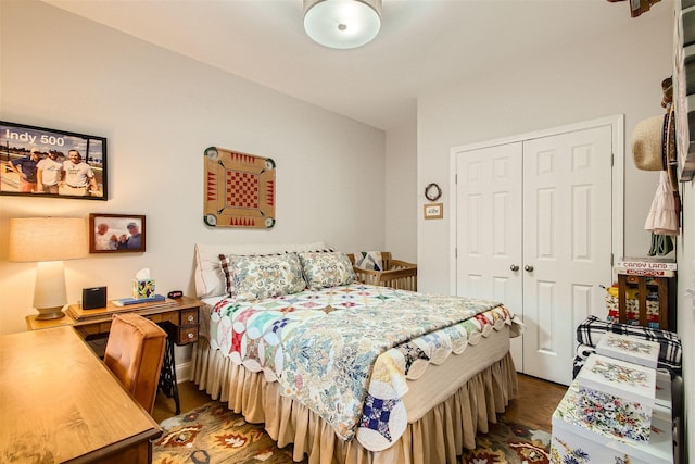 bedroom featuring dark hardwood / wood-style floors and a closet